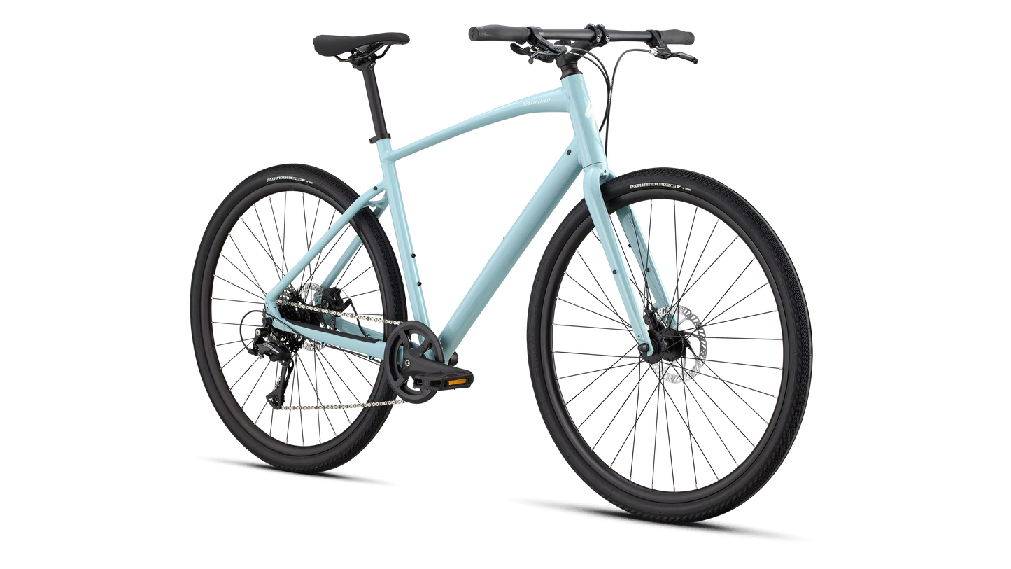 Light blue Specialized X1 hybrid bike with disc brakes and black tires.
